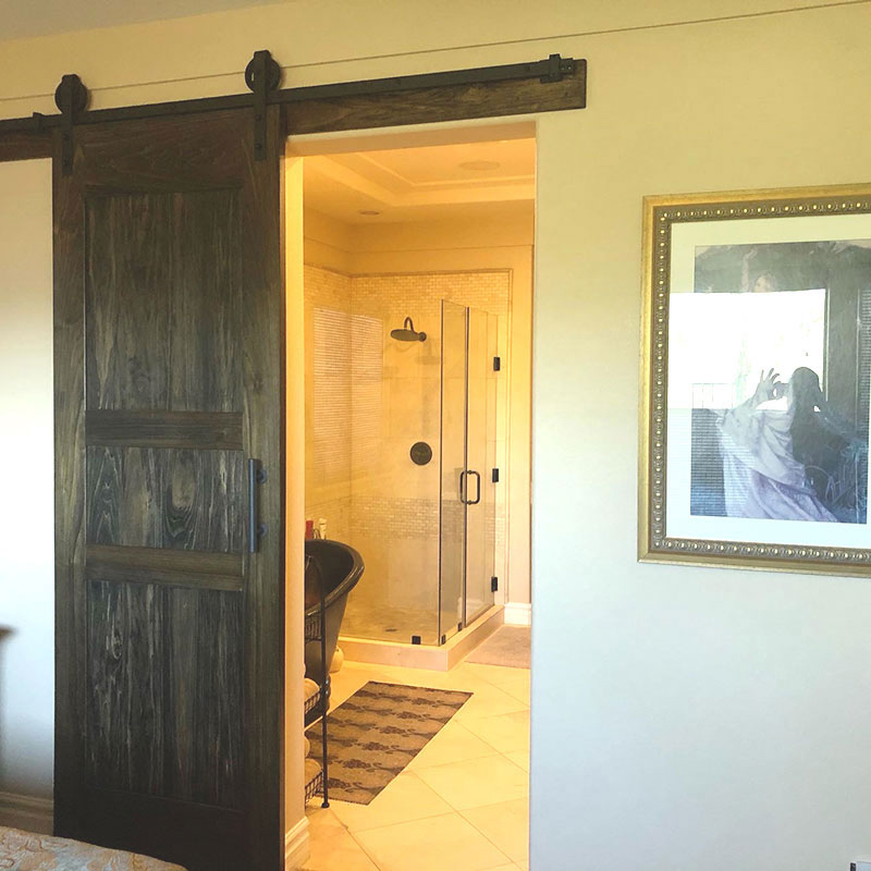 Formal Walnut Stained Three Panel Barn Door in Henderson Nevada